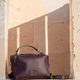 Piccolo bandolera in pelle bordeaux