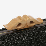 Schwarze geflochtene Clutch