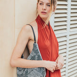 Hobo bag in metallic mesh with tropical print in black