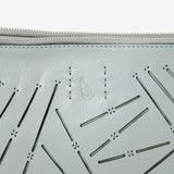 Women's shoulder bag in green perforated leather