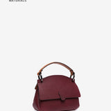 Bolso de mano pequeño en materiales reciclados burdeos
