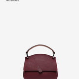 Bolso de mano pequeño en materiales reciclados burdeos