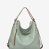 Bolso convertible en mochila de piel troquelada en verde