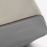 Bandolera en materiales reciclados en gris