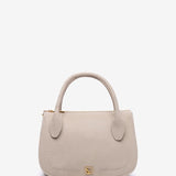 Beige Handtasche aus recycelten Materialien.