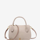 Beige Handtasche aus recycelten Materialien.