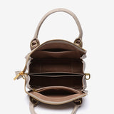 Bolso de mano pequeño en materiales reciclados beige