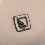 Small shoulder bag in beige patent leather