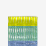 Grüne Bandana mit geometrischem Muster.