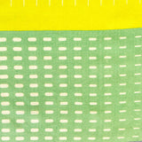 Grüne Bandana mit geometrischem Muster.