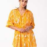 Kleid aus Baumwolle mit abstraktem Muster in Orange.