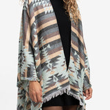 Poncho con estampado geométrico en beige
