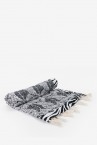 Beach towel with black and white tropical print