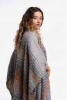 Poncho with striped print and blue fringes