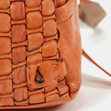 Women's backpack in orange braided leather