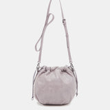 Women's bucket-style crossbody bag in lavender die-cut leather