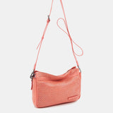 Bandolera de mujer en piel troquelada coral