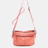 Bandolera de mujer en piel troquelada coral