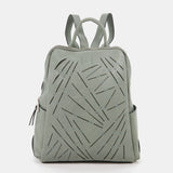 Damentasche aus grünem gestanztem Leder.