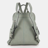 Damentasche aus grünem gestanztem Leder.