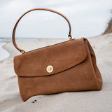 Shoulder bag in cognac suede