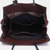 Bolso de mano en piel burdeos