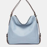 Multifunktionale Tasche aus hellblauem Leder
