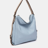 Multifunktionale Tasche aus hellblauem Leder