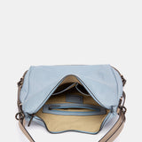 Multifunktionale Tasche aus hellblauem Leder