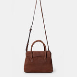 Handtasche aus braunem Leder.