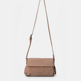 Beige leather crossbody bag.