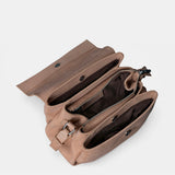 Beige leather crossbody bag.