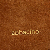 Borsa multifunzionale in camoscio color cognac.