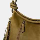 Grüner Schulterledertasche mit Fransen.