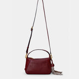 Bolso de mano en piel troquelada burdeos