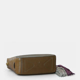 Bolso de mano en piel troquelada verde