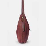 Burgundy suede shoulder bag.
