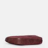 Burgundy suede shoulder bag.