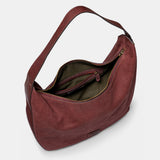 Burgundy suede shoulder bag.