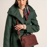 Burgundy suede crossbody bag.