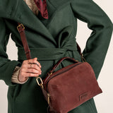 Burgundy suede crossbody bag.
