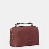 Burgundy suede crossbody bag.