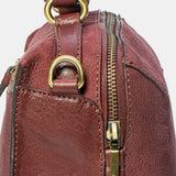 Burgundy suede crossbody bag.