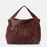 Shopper aus bordeauxfarbenem Veloursleder.
