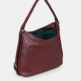 Multifunctional burgundy leather bag.
