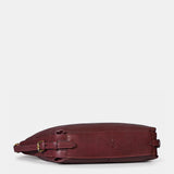 Multifunctional burgundy leather bag.