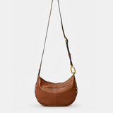 Schultertasche aus cognacfarbenem Veloursleder.