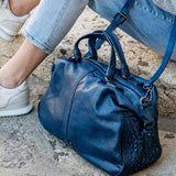 Women's leather bowling bag with braiding in blue