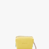 Small women's leather toiletry bag with yellow die-cut logo