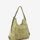 Women's backpack bag in green die-cut leather